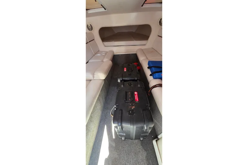 Slide: The Image of Interior of a 2007 Donzi 38 ZR boat with seating and luggage. - 30