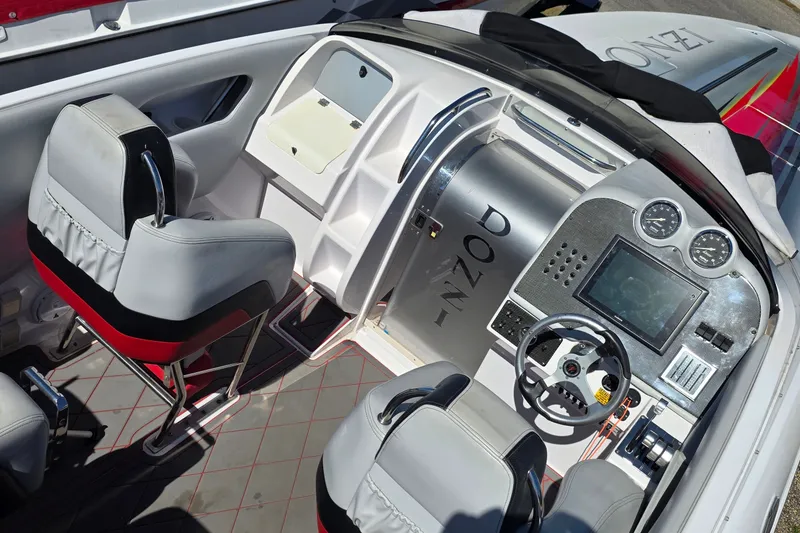 Slide: The Image of Cockpit of 2007 Donzi 38 ZR boat with modern controls and seating. - 8