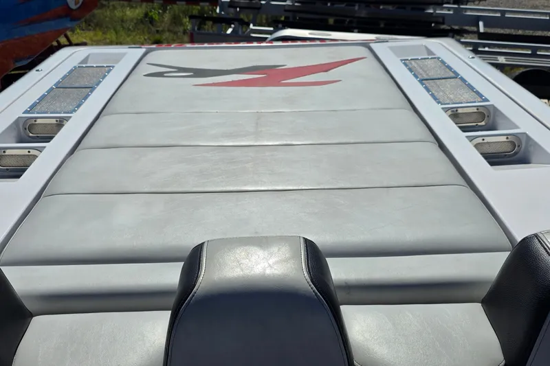 Slide: The Image of 2007 Donzi 38 ZR boat deck with sleek gray upholstery and red logo. - 38