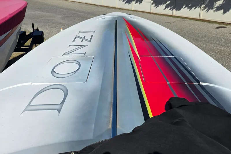 Slide: The Image of 2007 Donzi 38 ZR boat with sleek design and vibrant red accents. - 12