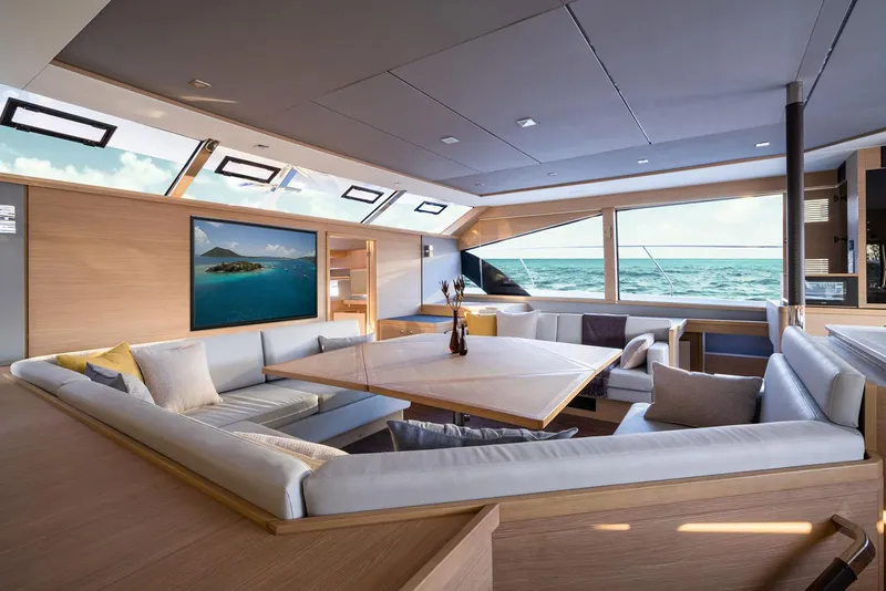 Slide: The Image of Manufacturer Provided Image: Luxurious interior of 2026 Aquila 54 Yacht with ocean view and modern seating. - 9