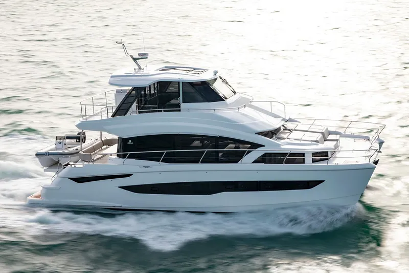 Slide: The Image of Manufacturer Provided Image: 2026 Aquila 54 Yacht cruising on open water, showcasing sleek design and modern features. - 1