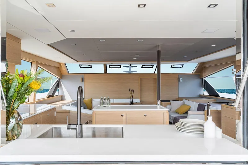 Slide: The Image of Manufacturer Provided Image: Luxurious interior of 2026 Aquila 54 Yacht with modern kitchen and seating area. - 8