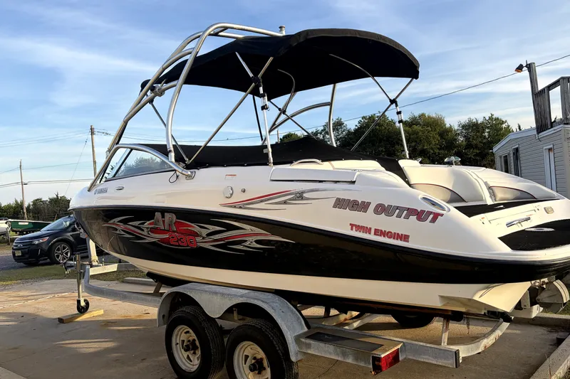 Slide: The Image of 2006 Yamaha Boats AR230 on trailer, featuring high output twin engine design. - 1
