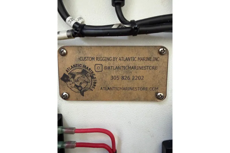 Slide: The Image of Plaque on 2019 Mako 284 Center Console by Atlantic Marine, featuring contact details. - 33