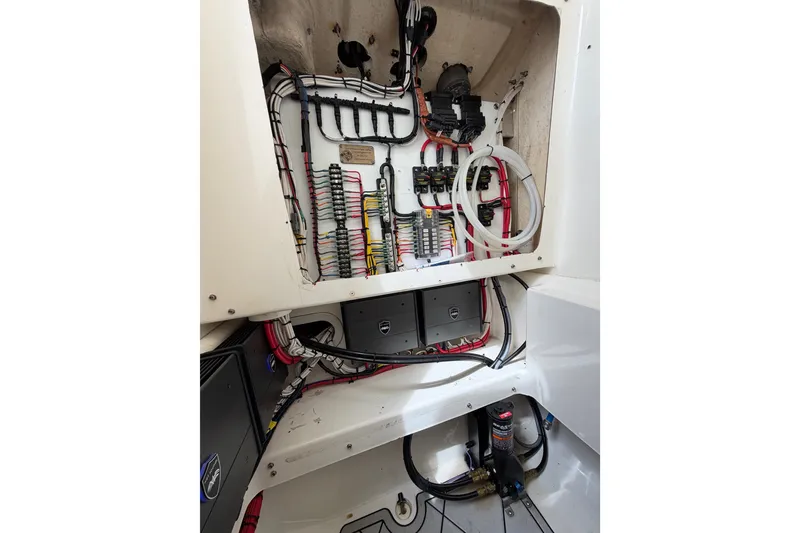 Slide: The Image of Electrical wiring and components inside a 2019 Mako 284 Center Console boat. - 28