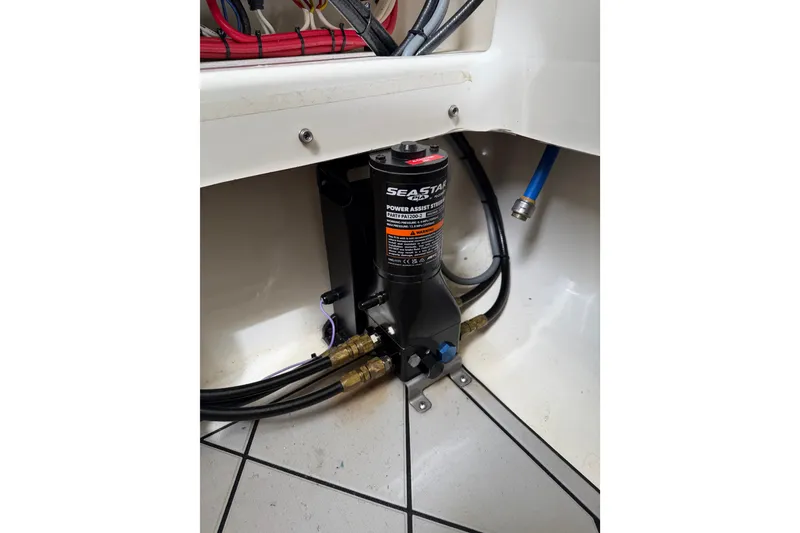 Slide: The Image of SeaStar power assist steering system in 2019 Mako 284 Center Console boat. - 29