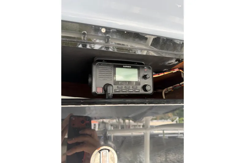 Slide: The Image of Garmin radio installed on a 2019 Mako 284 Center Console boat. - 18