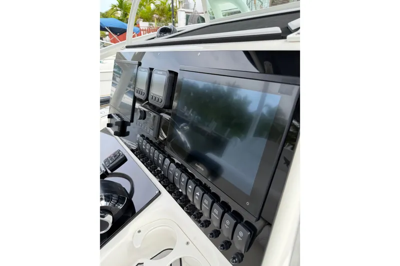 Slide: The Image of 2019 Mako 284 Center Console dashboard with modern navigation and control systems. - 15