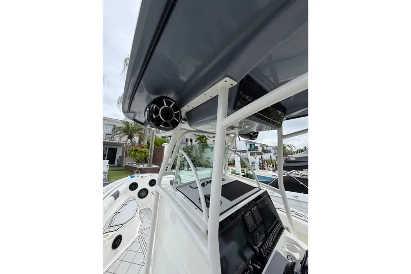 Slide: The Image of 2019 Mako 284 Center Console boat interior with modern dashboard and speaker system. - 25