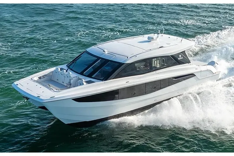 Slide: The Image of Manufacturer Provided Image: 2026 Aquila 46 Coupe yacht cruising on open water. - 2