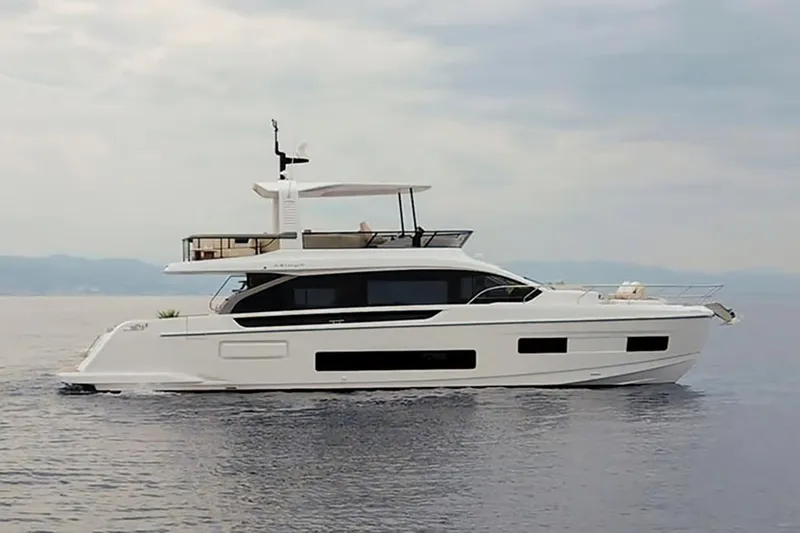 The Image of Manufacturer Provided Image: 2025 Azimut Fly 62 yacht cruising on calm waters under a cloudy sky. - 3