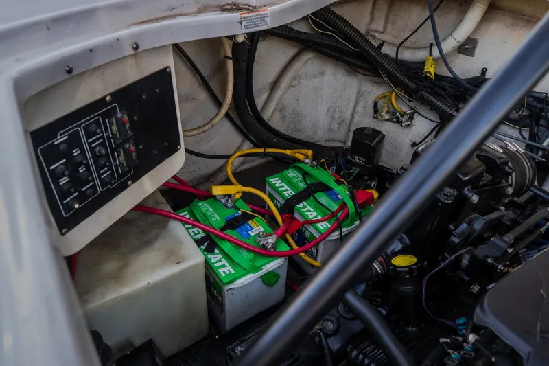 Slide: The Image of Engine compartment of a 2009 Crownline 260 LS boat with Interstate batteries. - 38