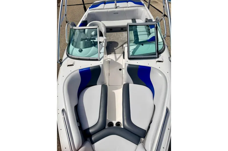 Slide: The Image of 2007 Moomba Outback V boat interior with blue and gray seating, open windshield. - 74