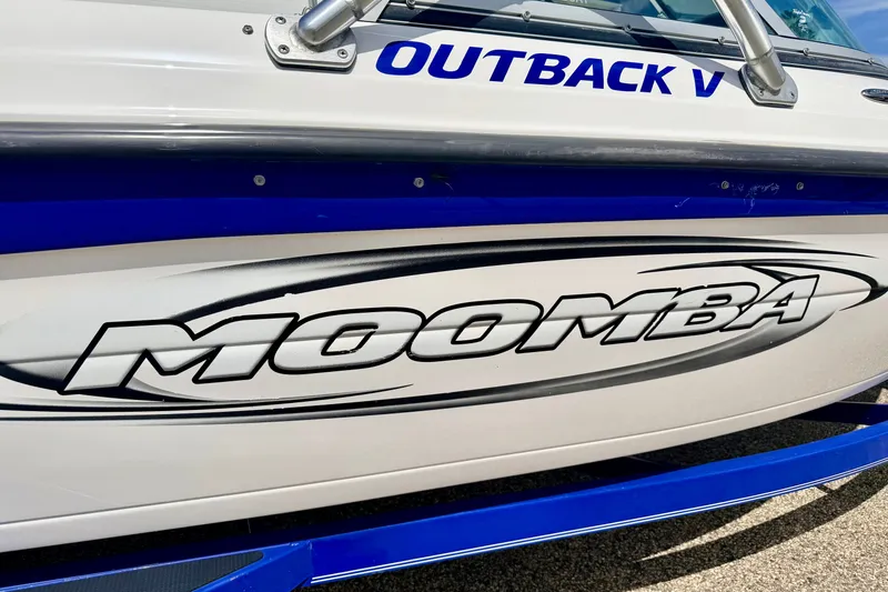 Slide: The Image of 2007 Moomba Outback V boat with bold logo and sleek design. - 13