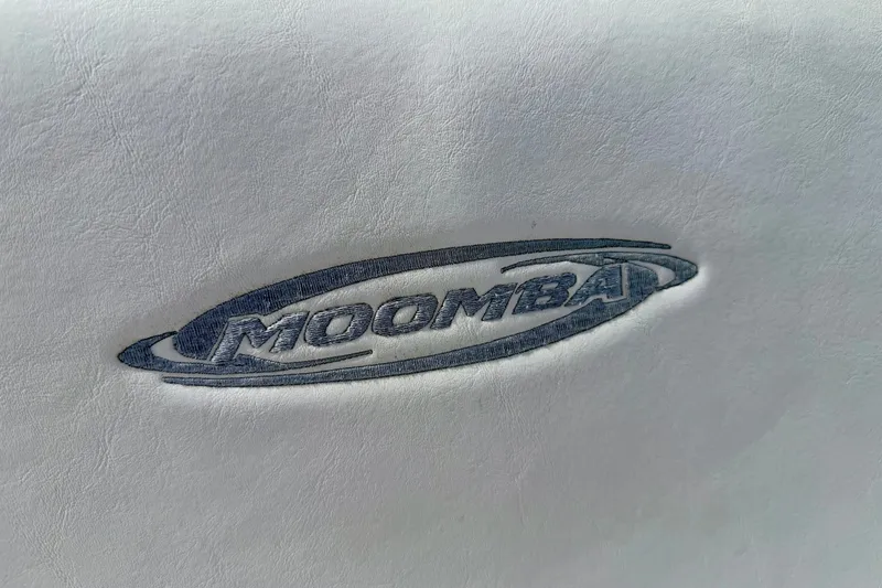 Slide: The Image of Moomba Outback V 2007 logo embossed on white leather surface. - 37