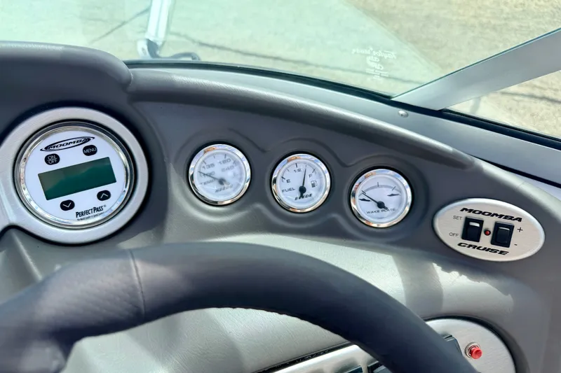 Slide: The Image of Dashboard of a 2007 Moomba Outback V boat with gauges and controls. - 52