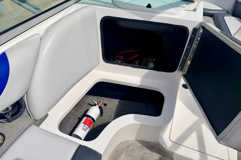 Slide: The Image of 2007 Moomba Outback V boat interior storage with fire extinguisher and equipment. - 46