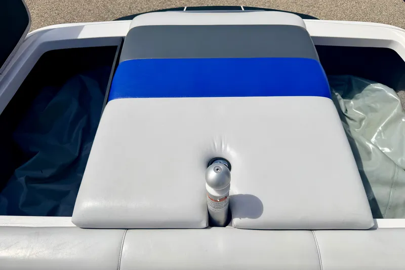 Slide: The Image of 2007 Moomba Outback V boat interior with blue and gray cushioned seating. - 27