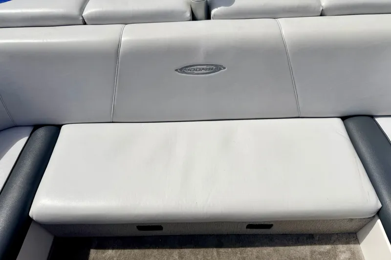 Slide: The Image of 2007 Moomba Outback V boat seat with logo, featuring white and gray upholstery. - 34