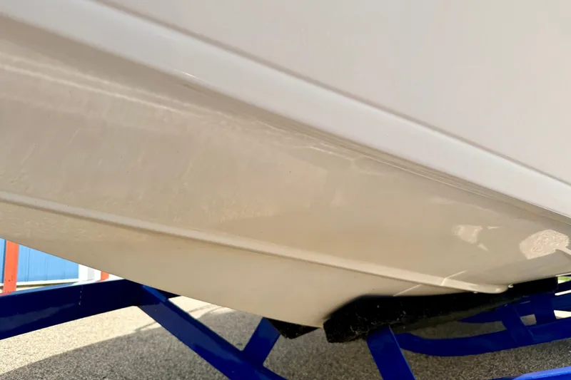 Slide: The Image of 2007 Moomba Outback V boat hull on blue trailer. - 80