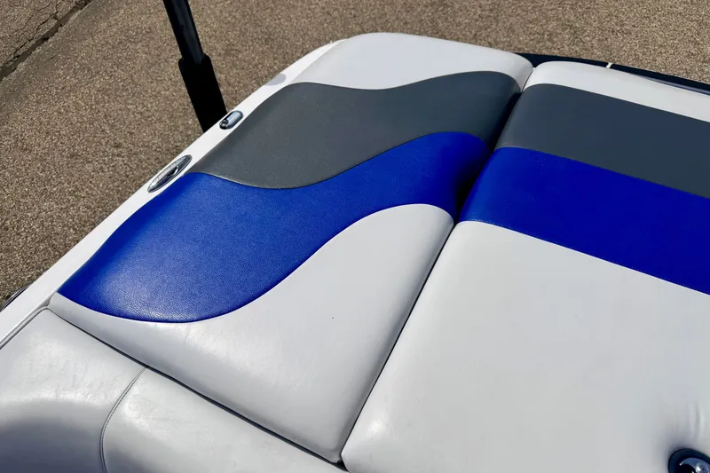 Slide: The Image of 2007 Moomba Outback V boat seat with blue, gray, and white upholstery design. - 23