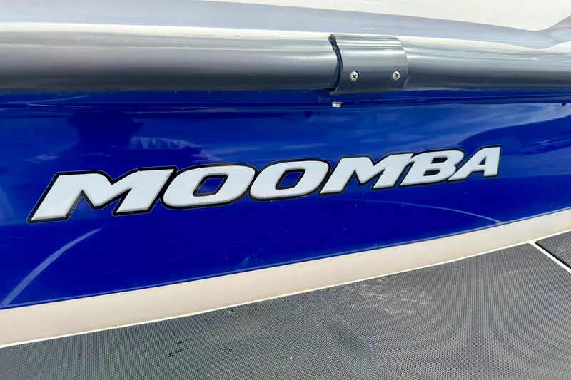 Slide: The Image of Blue 2007 Moomba Outback V boat with bold logo on the side. - 17