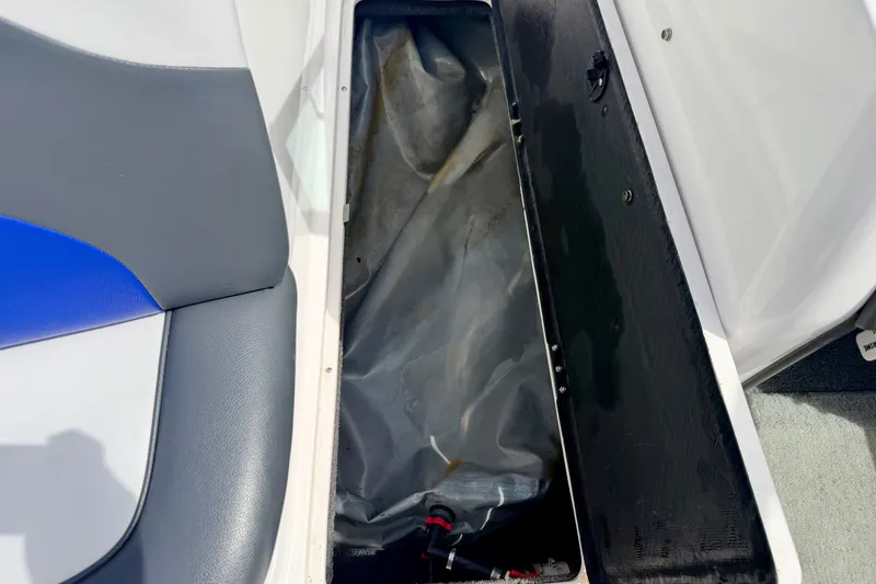 Slide: The Image of 2007 Moomba Outback V boat storage compartment with gray and blue seating. - 62