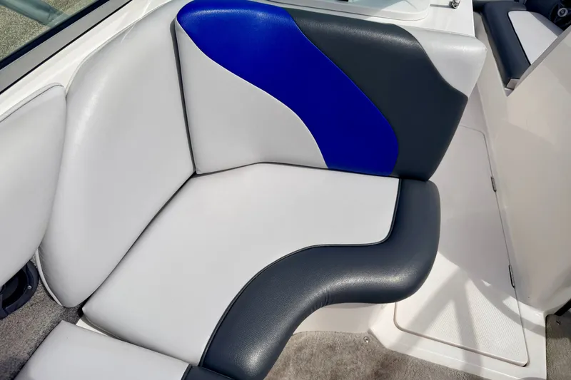 Slide: The Image of 2007 Moomba Outback V boat interior with blue, gray, and white cushioned seating. - 43