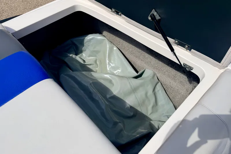 Slide: The Image of Open storage compartment in a 2007 Moomba Outback V boat, showing interior details. - 26