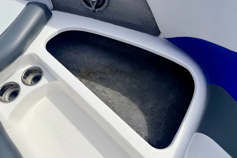 Slide: The Image of 2007 Moomba Outback V boat interior with cup holders and storage compartment. - 70