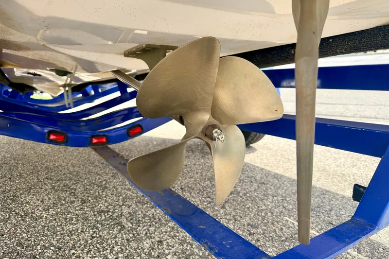 Slide: The Image of Propeller of a 2007 Moomba Outback V boat on a blue trailer. - 20