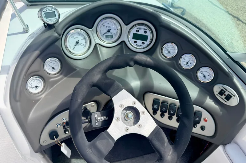 Slide: The Image of 2007 Moomba Outback V dashboard with steering wheel and gauges. - 50
