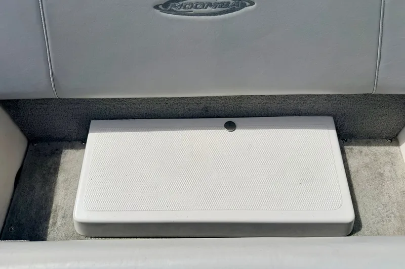 Slide: The Image of 2007 Moomba Outback V boat interior with storage compartment and logo. - 35