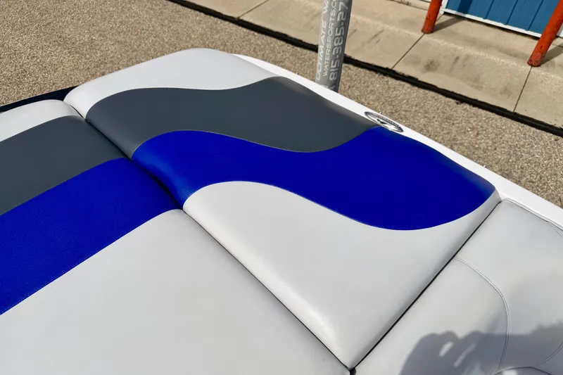 Slide: The Image of 2007 Moomba Outback V boat seat with blue, gray, and white upholstery design. - 25