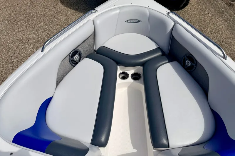 Slide: The Image of 2007 Moomba Outback V boat interior with cushioned seating and cup holders. - 64