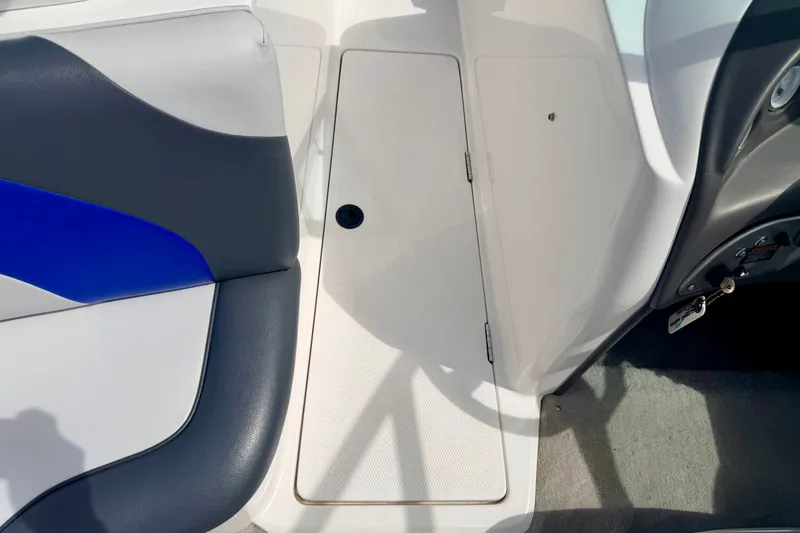 Slide: The Image of 2007 Moomba Outback V interior with blue and gray seating and storage compartment. - 61