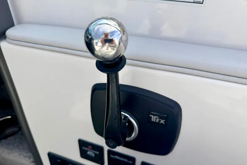Slide: The Image of Close-up of a 2007 Moomba Outback V boat throttle lever and ignition. - 57