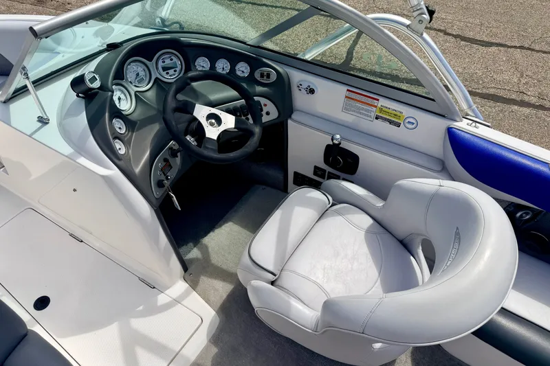 Slide: The Image of 2007 Moomba Outback V boat interior with steering wheel and gauges. - 49