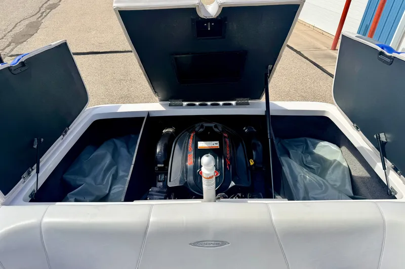 Slide: The Image of 2007 Moomba Outback V engine compartment with open hatches, showcasing the engine layout. - 29