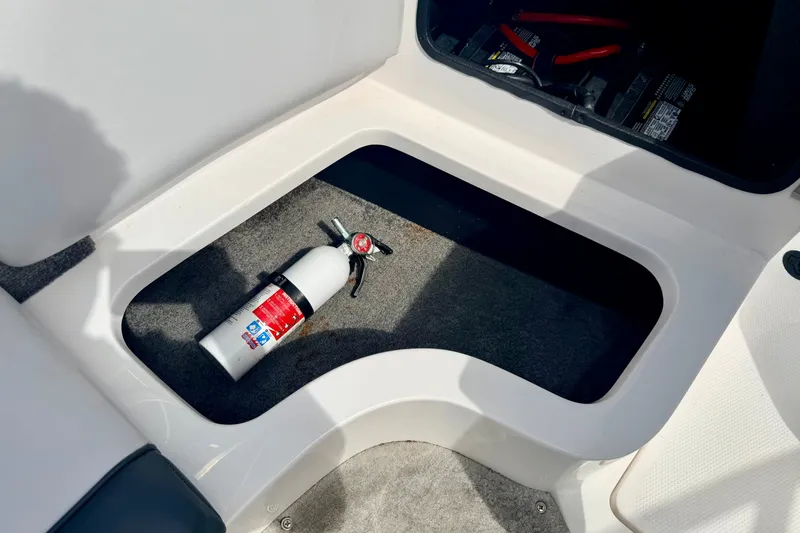 Slide: The Image of Storage compartment in a 2007 Moomba Outback V boat with a fire extinguisher. - 45