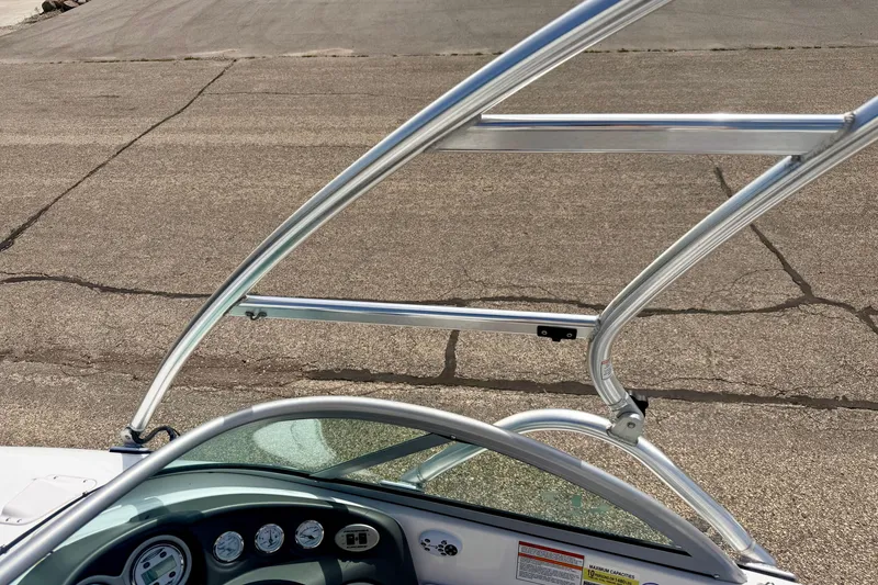Slide: The Image of 2007 Moomba Outback V boat with sleek metal framework and dashboard view. - 75