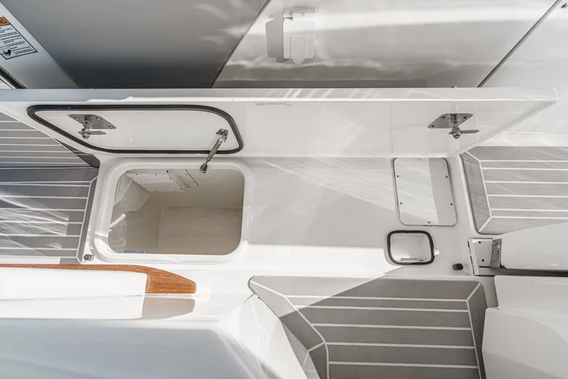 Slide: The Image of The image shows an open storage compartment on a boat with gray and white accents. - 41