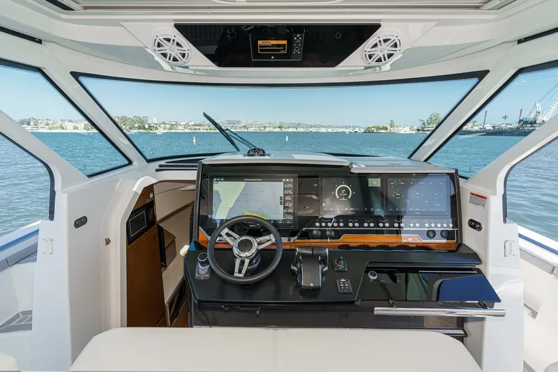 Slide: The Image of The 2023 Tiara Yachts 48 LS cockpit features modern navigation technology and luxurious amenities. - 31