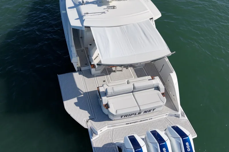 Slide: The Image of The 2023 Tiara Yachts 48 LS features a sleek design with a spacious deck and three engines. - 10