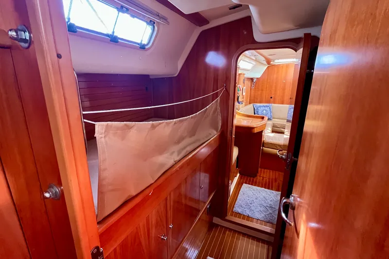Slide: The Image of Cozy interior of 2000 Moody 42 sailboat with wooden finish and comfortable seating. - 15