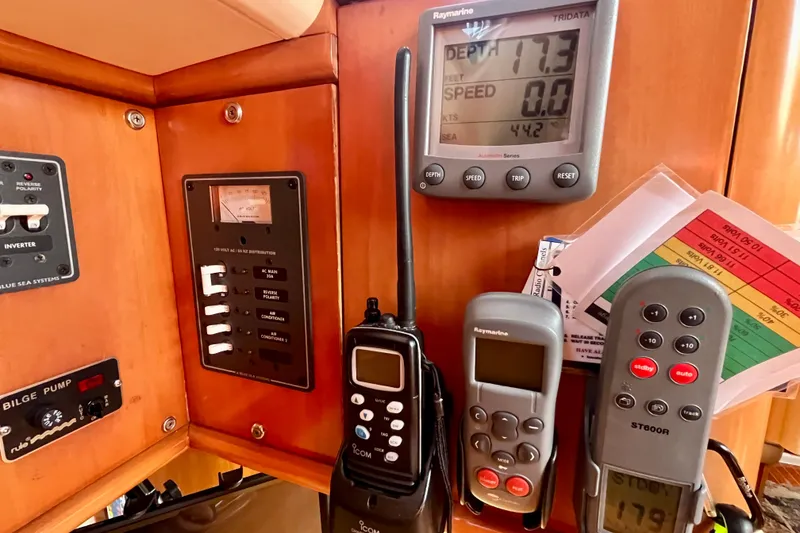 Slide: The Image of Control panel of a 2000 Moody 42 yacht with navigation and communication devices. - 38