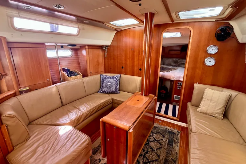 Slide: The Image of Luxurious interior of a 2000 Moody 42 yacht with leather seating and wooden finishes. - 5