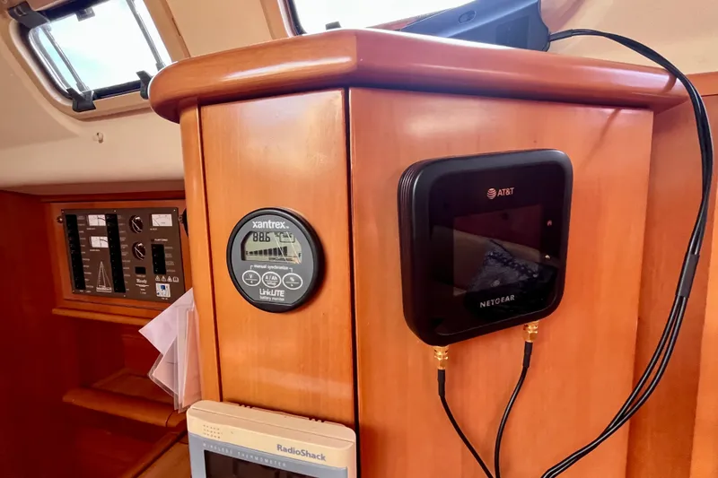 Slide: The Image of Control panel inside a 2000 Moody 42 yacht with Xantrex and Netgear devices. - 35