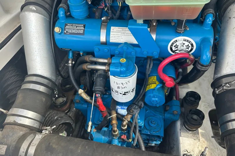 Slide: The Image of Engine compartment of a 2005 Tiara Yachts 2900 Coronet, showcasing detailed components. - 23